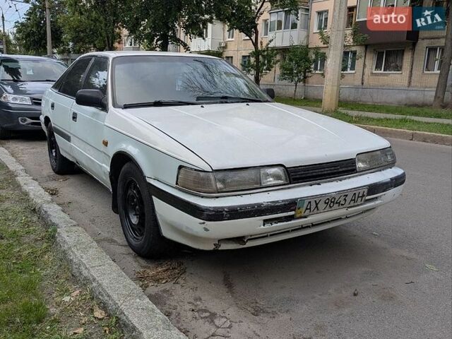 Белый Мазда 626, объемом двигателя 2.01 л и пробегом 380 тыс. км за 700 $, фото 1 на Automoto.ua