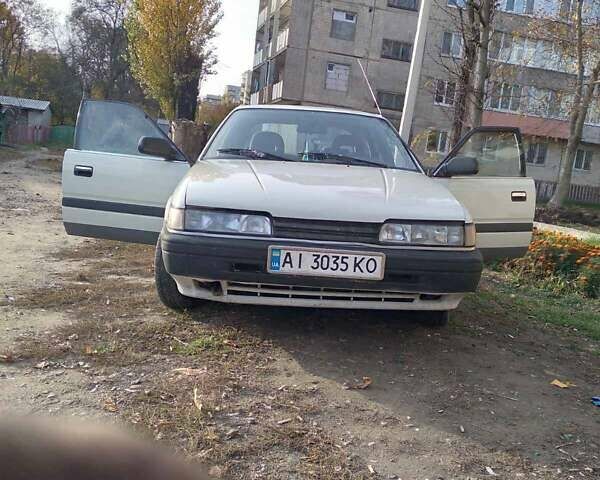 Белый Мазда 626, объемом двигателя 2 л и пробегом 200 тыс. км за 1500 $, фото 1 на Automoto.ua