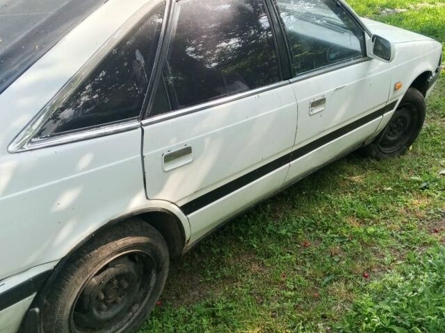 Білий Мазда 626, об'ємом двигуна 2 л та пробігом 200 тис. км за 607 $, фото 1 на Automoto.ua