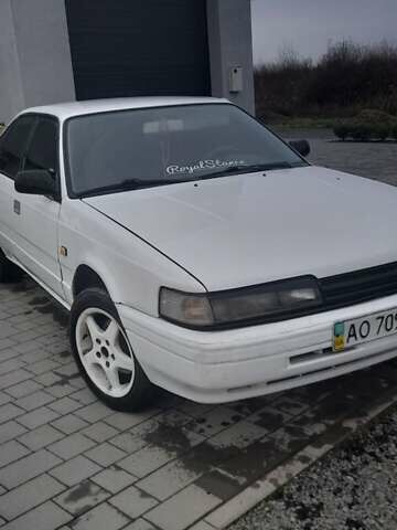 Белый Мазда 626, объемом двигателя 2 л и пробегом 323 тыс. км за 900 $, фото 1 на Automoto.ua