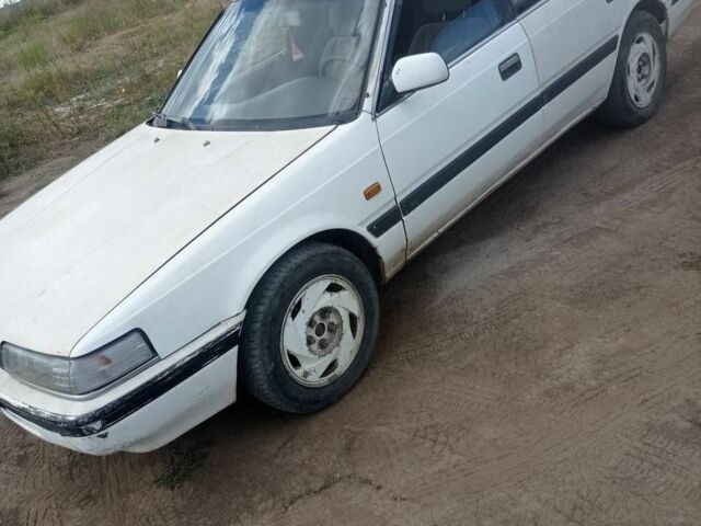 Белый Мазда 626, объемом двигателя 2 л и пробегом 400 тыс. км за 1102 $, фото 1 на Automoto.ua