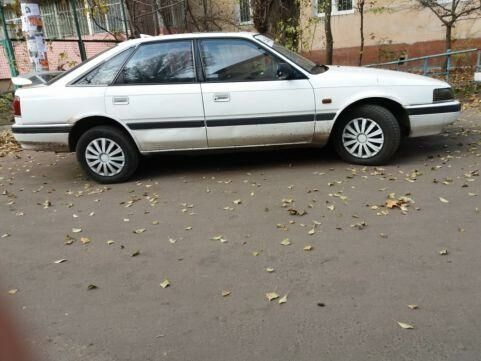 Белый Мазда 626, объемом двигателя 2 л и пробегом 296 тыс. км за 3000 $, фото 1 на Automoto.ua