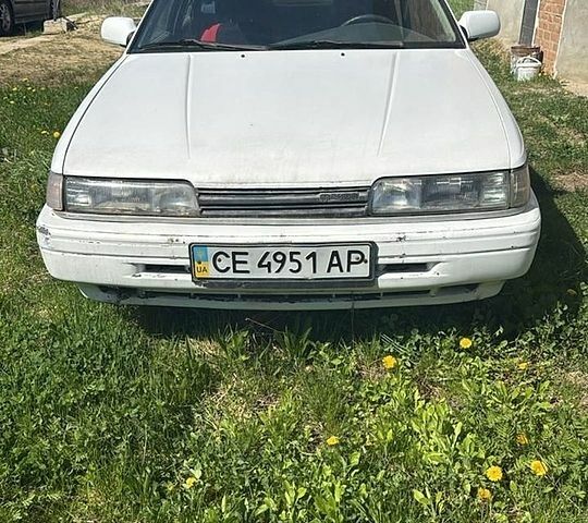 Белый Мазда 626, объемом двигателя 2 л и пробегом 352 тыс. км за 1001 $, фото 1 на Automoto.ua