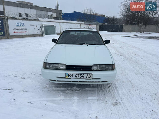 Белый Мазда 626, объемом двигателя 2 л и пробегом 330 тыс. км за 1500 $, фото 1 на Automoto.ua