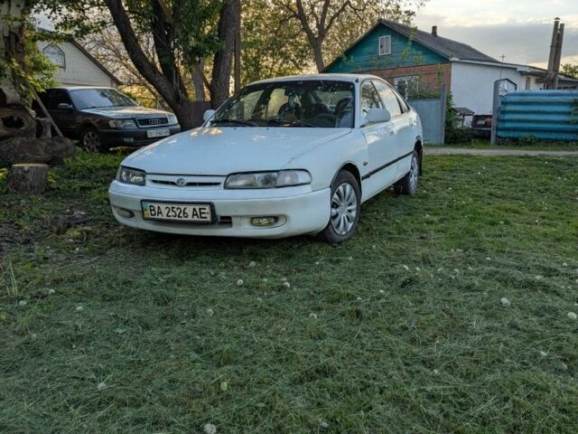 Белый Мазда 626, объемом двигателя 2 л и пробегом 350 тыс. км за 1050 $, фото 1 на Automoto.ua
