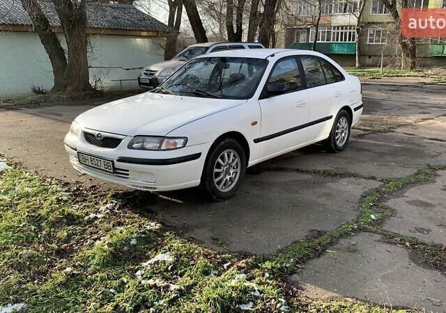 Белый Мазда 626, объемом двигателя 1.8 л и пробегом 321 тыс. км за 3525 $, фото 1 на Automoto.ua