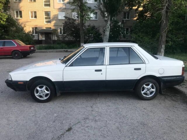 Белый Мазда 626, объемом двигателя 0 л и пробегом 100 тыс. км за 1400 $, фото 1 на Automoto.ua