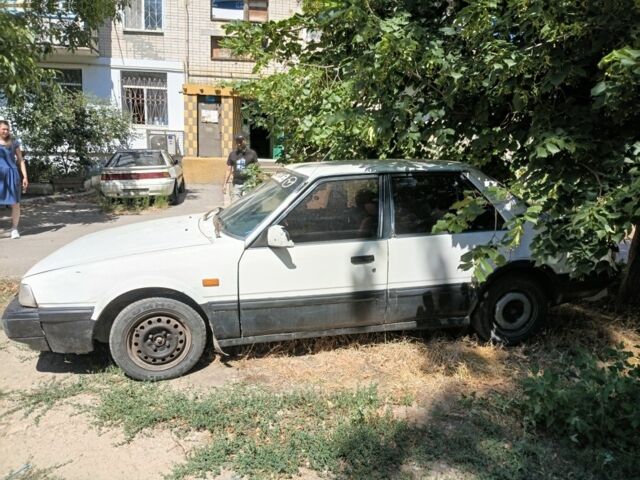 Білий Мазда 626, об'ємом двигуна 2 л та пробігом 300 тис. км за 202 $, фото 1 на Automoto.ua