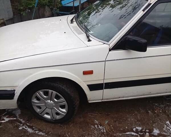 Белый Мазда 626, объемом двигателя 2 л и пробегом 344 тыс. км за 800 $, фото 1 на Automoto.ua