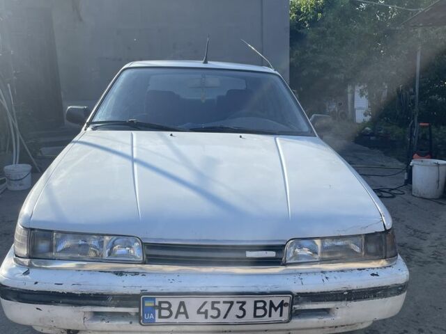 Белый Мазда 626, объемом двигателя 2 л и пробегом 429 тыс. км за 953 $, фото 1 на Automoto.ua