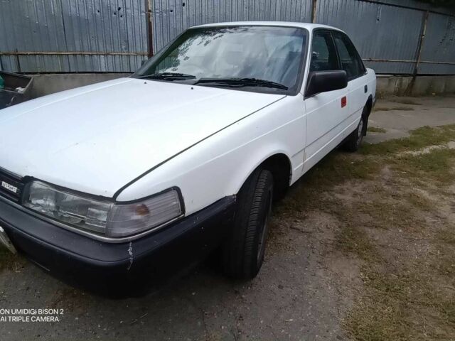 Белый Мазда 626, объемом двигателя 2 л и пробегом 331 тыс. км за 1069 $, фото 1 на Automoto.ua