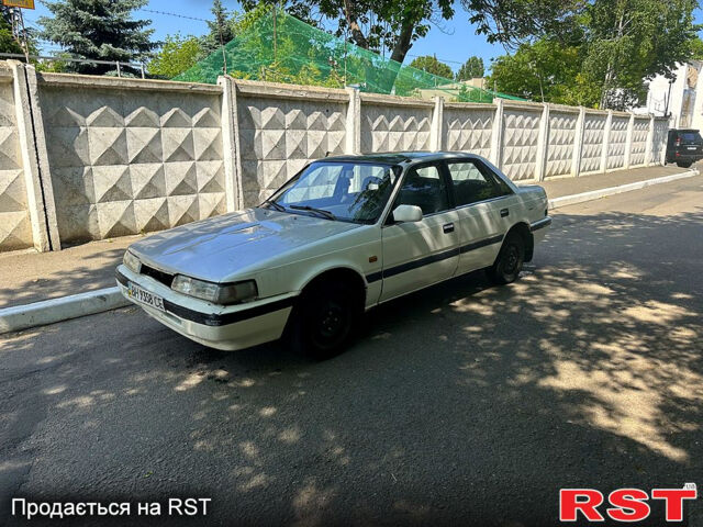 Белый Мазда 626, объемом двигателя 1.8 л и пробегом 310 тыс. км за 700 $, фото 1 на Automoto.ua