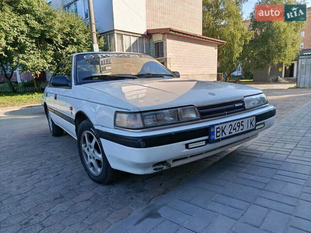 Белый Мазда 626, объемом двигателя 2 л и пробегом 499 тыс. км за 1700 $, фото 1 на Automoto.ua