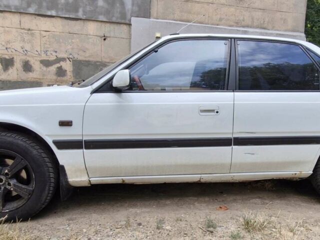 Белый Мазда 626, объемом двигателя 2.18 л и пробегом 490 тыс. км за 1200 $, фото 1 на Automoto.ua