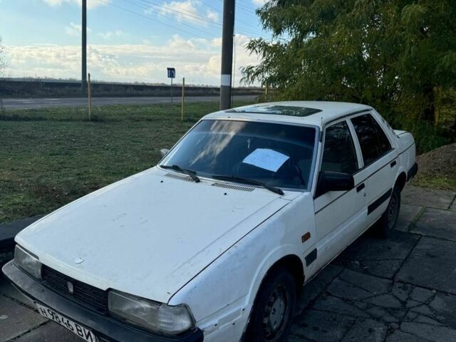 Белый Мазда 626, объемом двигателя 2 л и пробегом 200 тыс. км за 345 $, фото 1 на Automoto.ua