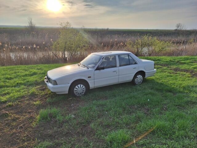 Белый Мазда 626, объемом двигателя 2 л и пробегом 100 тыс. км за 1467 $, фото 1 на Automoto.ua