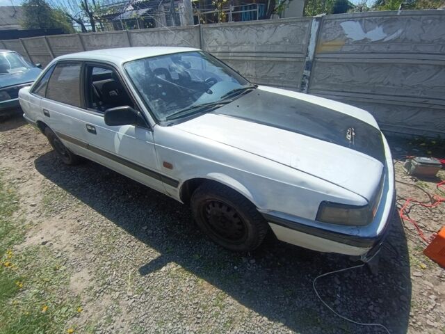 Белый Мазда 626, объемом двигателя 2 л и пробегом 234 тыс. км за 256 $, фото 1 на Automoto.ua