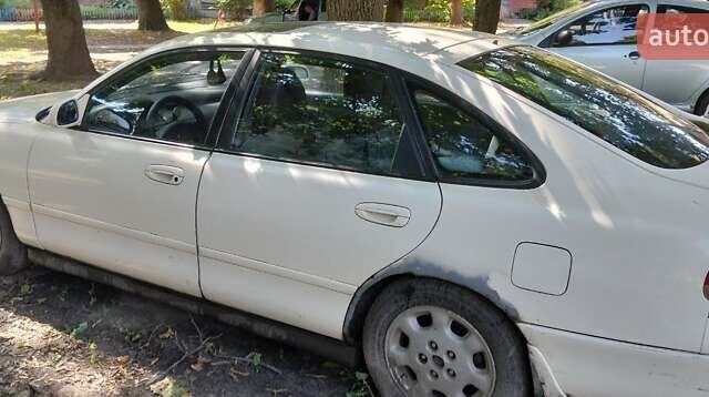 Белый Мазда 626, объемом двигателя 2.5 л и пробегом 324 тыс. км за 800 $, фото 1 на Automoto.ua