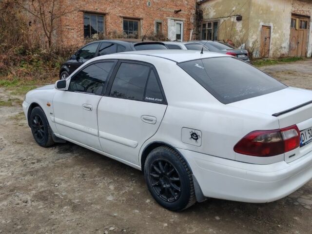 Белый Мазда 626, объемом двигателя 2 л и пробегом 300 тыс. км за 1800 $, фото 1 на Automoto.ua