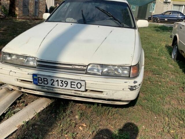 Белый Мазда 626, объемом двигателя 2 л и пробегом 300 тыс. км за 523 $, фото 1 на Automoto.ua