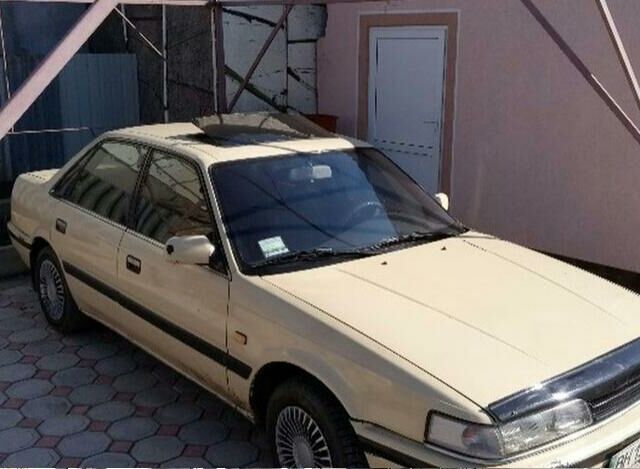 Бежевий Мазда 626, об'ємом двигуна 2 л та пробігом 357 тис. км за 1750 $, фото 1 на Automoto.ua