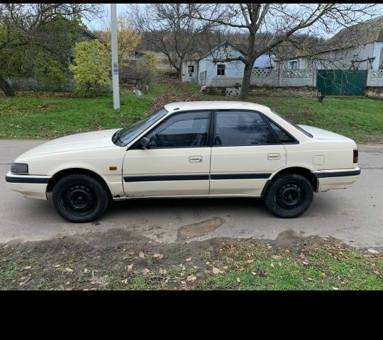 Бежевый Мазда 626, объемом двигателя 2 л и пробегом 210 тыс. км за 1800 $, фото 1 на Automoto.ua