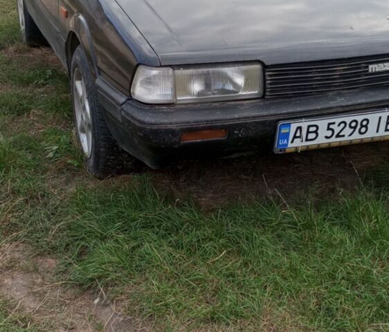 Черный Мазда 626, объемом двигателя 2 л и пробегом 450 тыс. км за 556 $, фото 1 на Automoto.ua