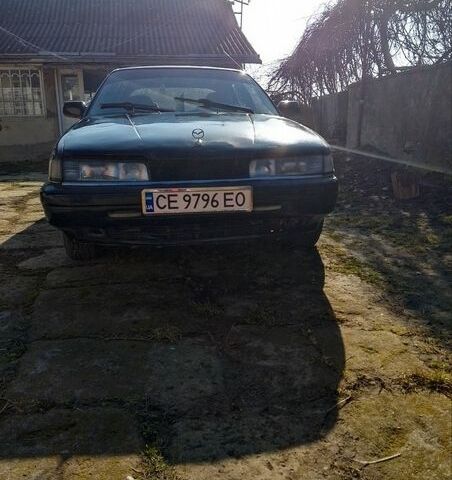 Черный Мазда 626, объемом двигателя 2 л и пробегом 2 тыс. км за 1100 $, фото 1 на Automoto.ua