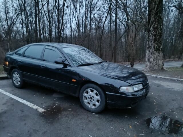 Черный Мазда 626, объемом двигателя 2.5 л и пробегом 480 тыс. км за 1400 $, фото 1 на Automoto.ua