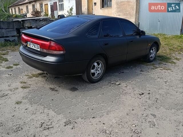 Черный Мазда 626, объемом двигателя 2 л и пробегом 400 тыс. км за 1800 $, фото 1 на Automoto.ua
