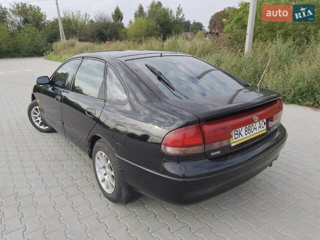 Черный Мазда 626, объемом двигателя 1.84 л и пробегом 430 тыс. км за 1900 $, фото 1 на Automoto.ua