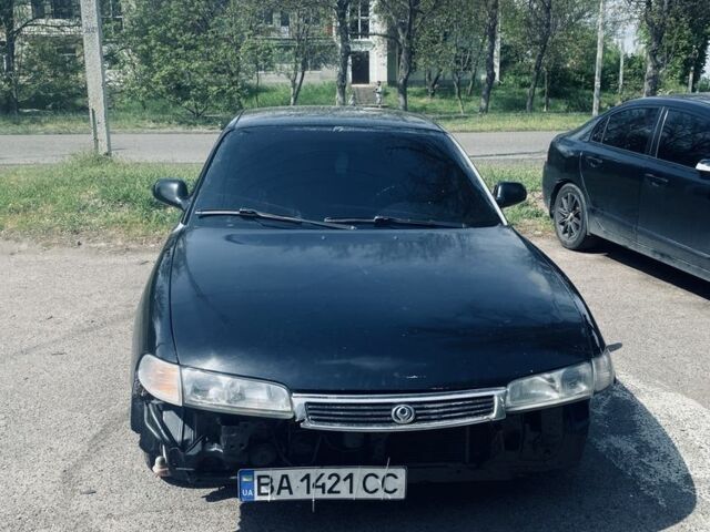 Черный Мазда 626, объемом двигателя 2 л и пробегом 200 тыс. км за 1450 $, фото 1 на Automoto.ua