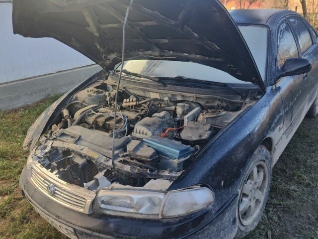 Черный Мазда 626, объемом двигателя 2 л и пробегом 480 тыс. км за 750 $, фото 1 на Automoto.ua