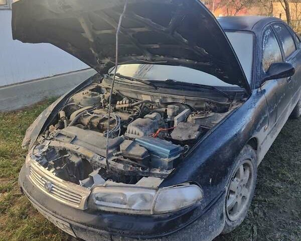 Черный Мазда 626, объемом двигателя 2 л и пробегом 111 тыс. км за 750 $, фото 1 на Automoto.ua