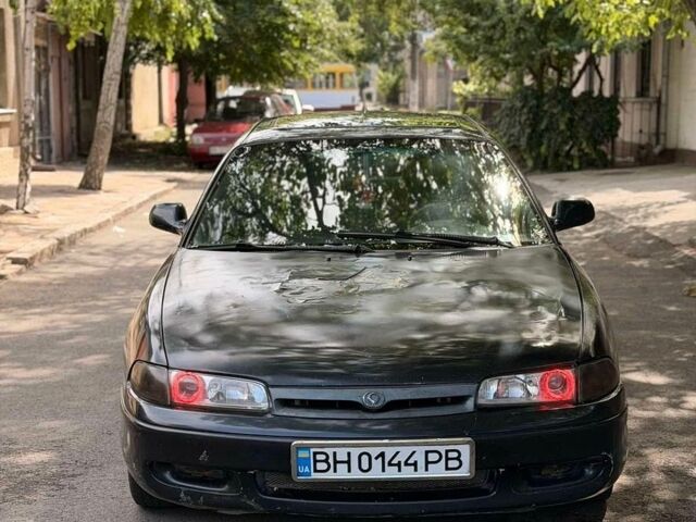 Чорний Мазда 626, об'ємом двигуна 1.8 л та пробігом 225 тис. км за 1100 $, фото 1 на Automoto.ua
