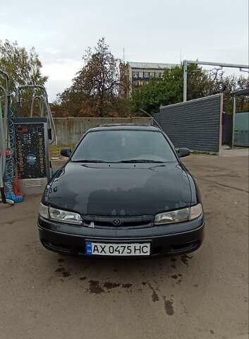 Черный Мазда 626, объемом двигателя 1.8 л и пробегом 200 тыс. км за 1800 $, фото 1 на Automoto.ua