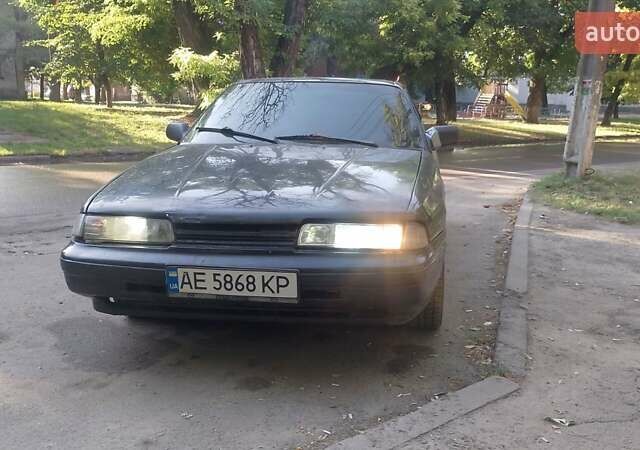 Черный Мазда 626, объемом двигателя 2.2 л и пробегом 400 тыс. км за 1200 $, фото 1 на Automoto.ua