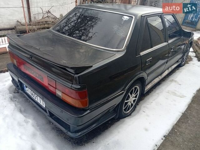 Чорний Мазда 626, об'ємом двигуна 2 л та пробігом 274 тис. км за 1000 $, фото 1 на Automoto.ua