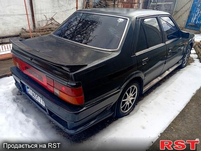 Черный Мазда 626, объемом двигателя 2 л и пробегом 300 тыс. км за 1000 $, фото 1 на Automoto.ua