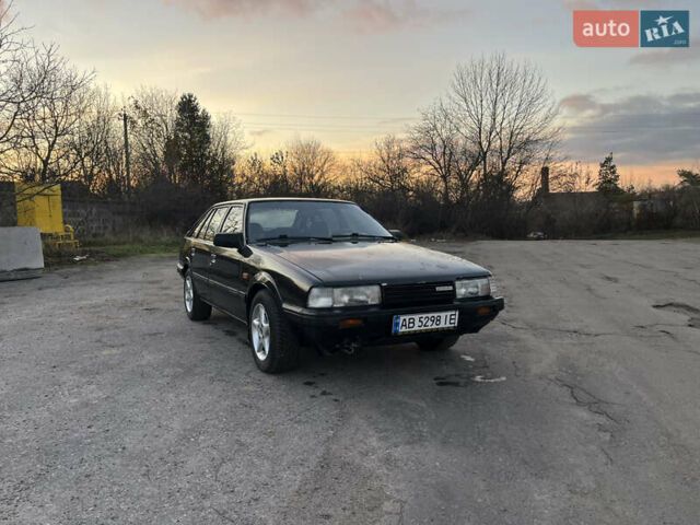 Черный Мазда 626, объемом двигателя 2 л и пробегом 420 тыс. км за 1300 $, фото 1 на Automoto.ua