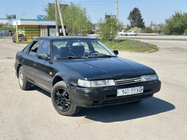 Черный Мазда 626, объемом двигателя 2 л и пробегом 300 тыс. км за 699 $, фото 1 на Automoto.ua