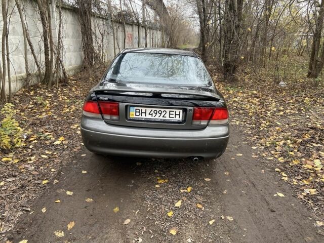 Черный Мазда 626, объемом двигателя 2 л и пробегом 300 тыс. км за 1150 $, фото 1 на Automoto.ua