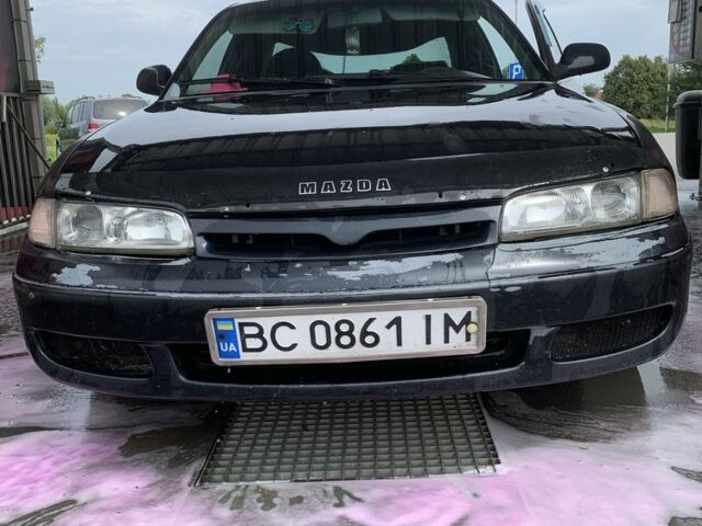 Черный Мазда 626, объемом двигателя 2 л и пробегом 345 тыс. км за 1100 $, фото 1 на Automoto.ua