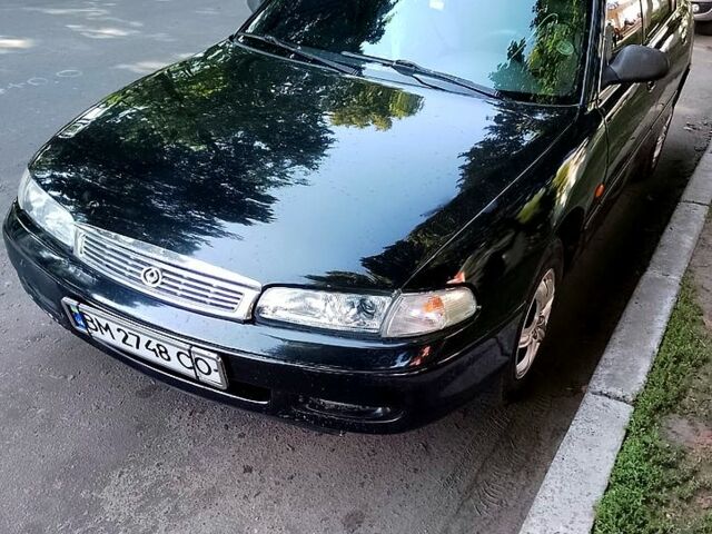 Черный Мазда 626, объемом двигателя 1.8 л и пробегом 270 тыс. км за 2300 $, фото 1 на Automoto.ua