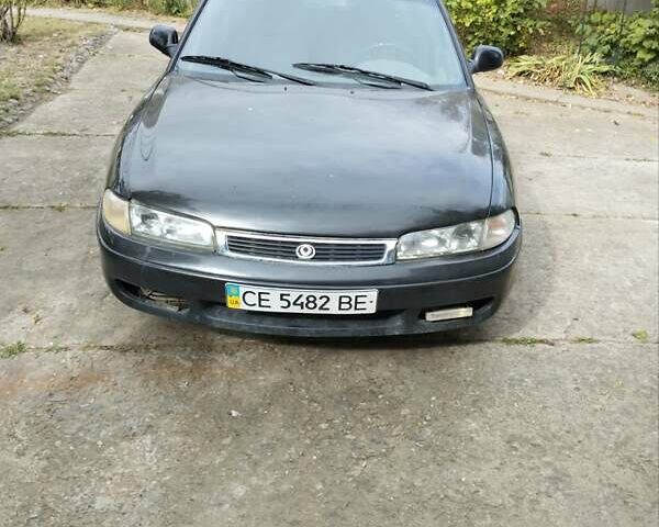 Черный Мазда 626, объемом двигателя 2 л и пробегом 320 тыс. км за 2500 $, фото 1 на Automoto.ua