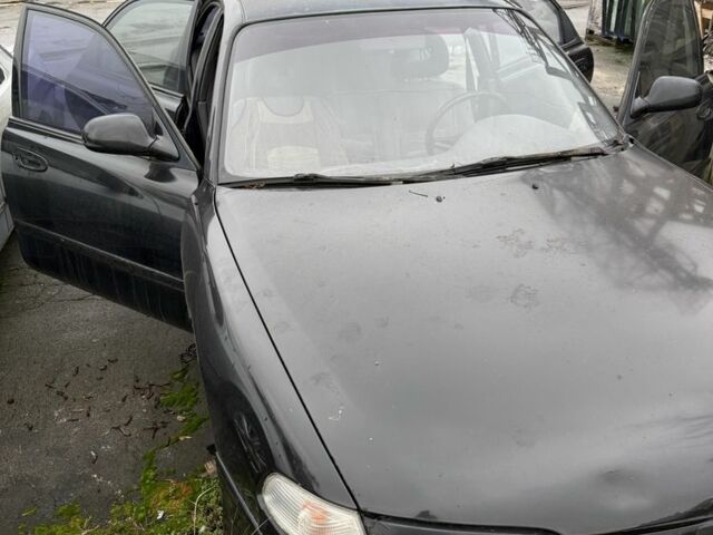 Черный Мазда 626, объемом двигателя 1.8 л и пробегом 390 тыс. км за 993 $, фото 1 на Automoto.ua