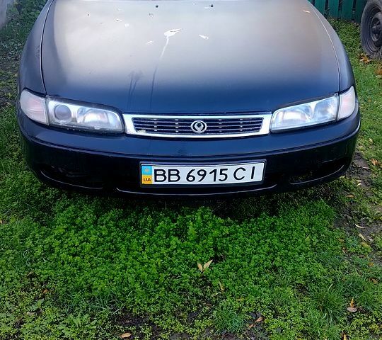 Чорний Мазда 626, об'ємом двигуна 2 л та пробігом 200 тис. км за 2000 $, фото 1 на Automoto.ua