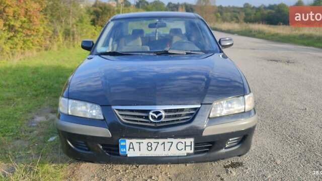 Черный Мазда 626, объемом двигателя 2 л и пробегом 260 тыс. км за 2700 $, фото 1 на Automoto.ua