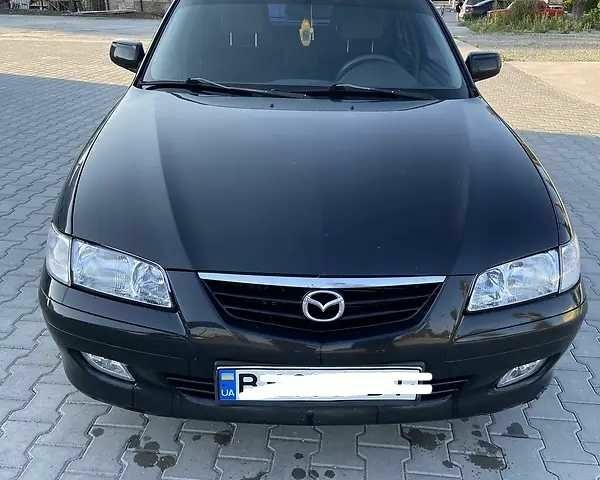 Черный Мазда 626, объемом двигателя 2 л и пробегом 210 тыс. км за 3000 $, фото 1 на Automoto.ua