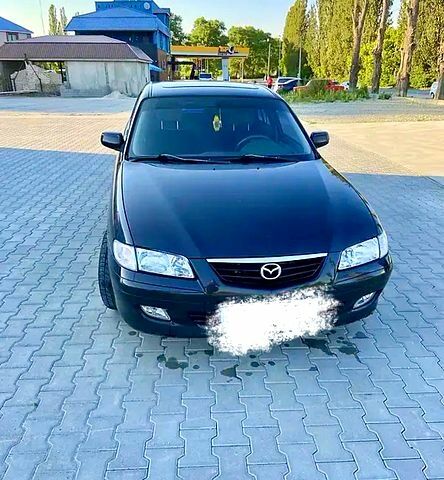 Черный Мазда 626, объемом двигателя 2 л и пробегом 208 тыс. км за 3000 $, фото 1 на Automoto.ua